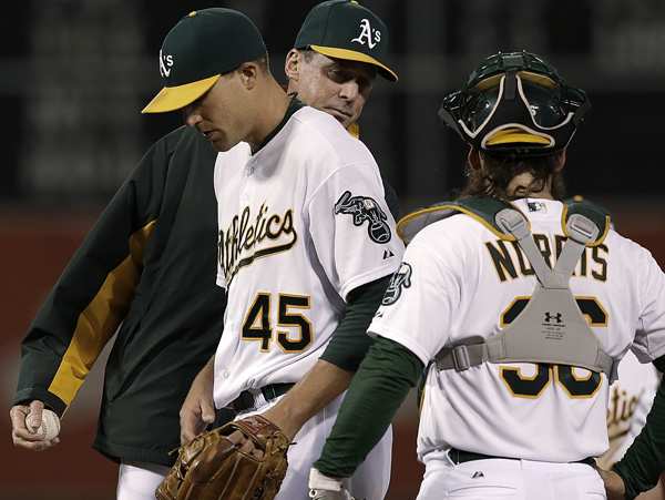 Jim Johnson took two losses in his brief stint as Oakland's closer. (Jeff Chiu/AP)